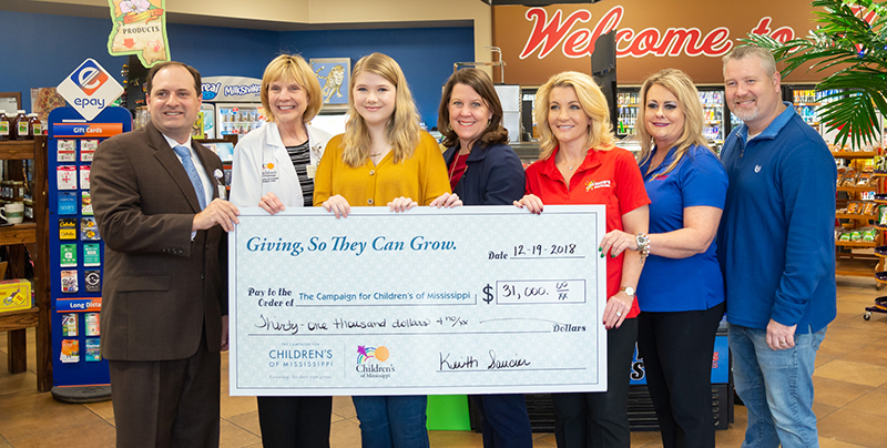 Celebrating the $31,000 Keith’s Superstores donation are, from left, Collier Young, Dr. Phyllis Bishop, Bailey Sanderford, Natalie Hutto, Melissa Saucier, Virginia Catt and Richie Bullock.